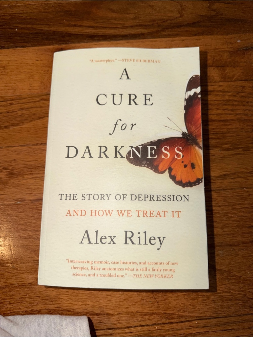 Alex Riley A Cure for Darkness - White & Orange Cover